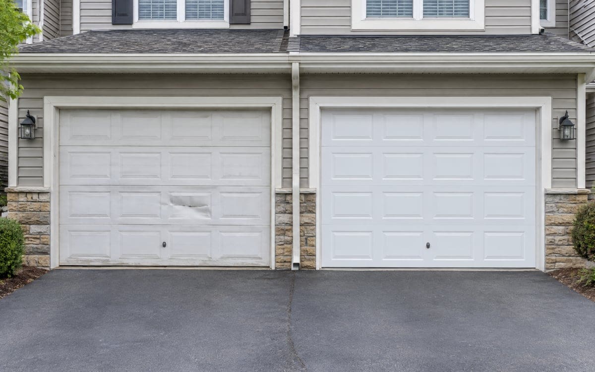 Two garage doors side by side, one with a dented panel and one undamaged, a repair or replace garage door comparison.